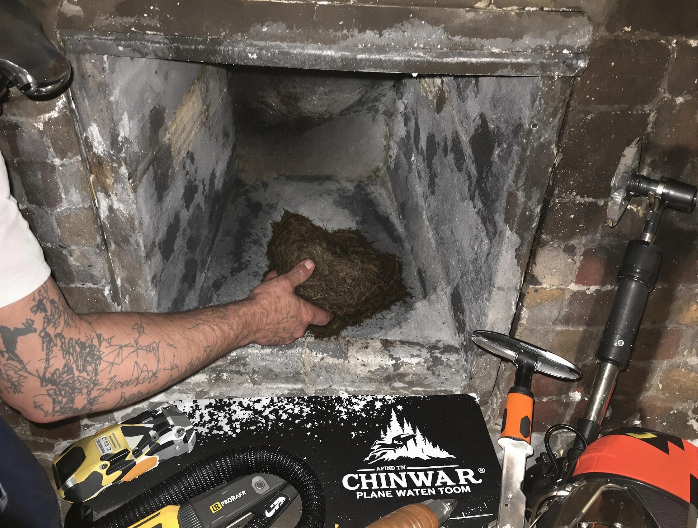 Milford Chimney Sweep safely removing debris and screening chimney in Milford, MA