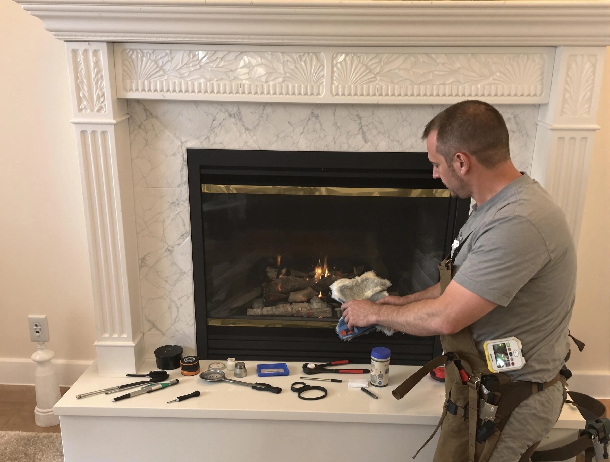 Milford Chimney Sweep performing fireplace maintenance in Milford, MA